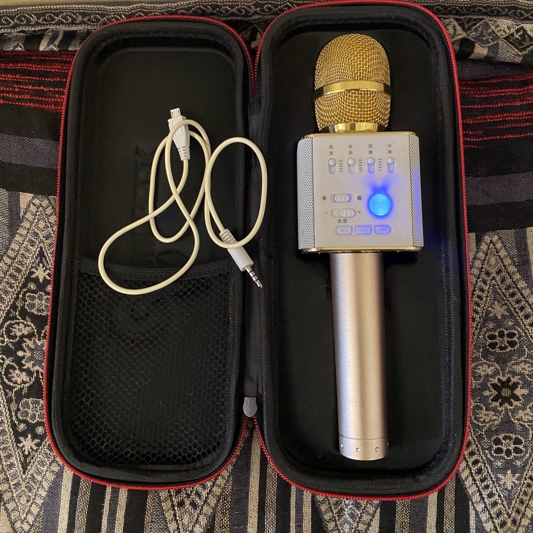 MicGeek Wireless Karaoke Microphone with Case (Category: Microphones) located in Baguio. Submitted by thrift_bonita (Listing ID 1468344012, Image 3). Description: - Brand: MicGeek Wireless Karaoke Microphone - Color: Elegant Gold and White - Connectivity: Bluetooth compatible with Android and iOS - Sound Controls: Front sliders for volume, bass, treble, and reverb - Condition: Clean, powers on, and ready for use - Inclusions: Charging cable and d