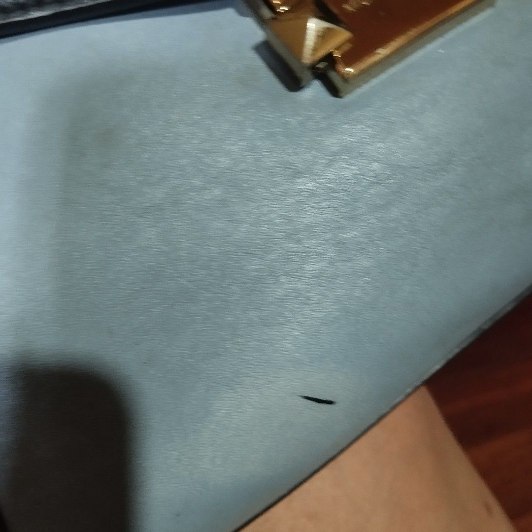 Michael Kors Blue and Black Shoulder Bag (Category: Shoulder Bags) located in Manila. Submitted by lene48 (Listing ID 1468388479, Image 3). Description: - Brand: Michael Kors - Style: Shoulder bag with single top handle - Color: Light blue with black trim - Hardware: Gold-tone with geometric branded closure lock - Condition: Pre-loved with minor scuffs, small marks, and light wear on the leather surface and edges - Perfect for everyday chic or ca