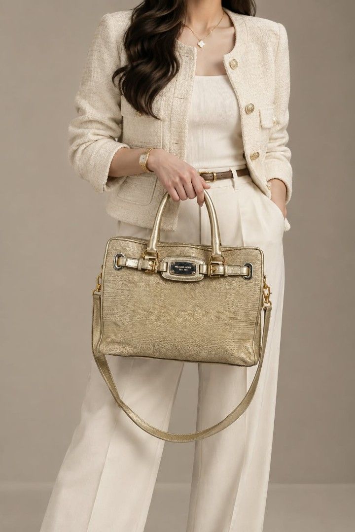 Michael Kors Hamilton Large E/W Tote Bag (Category: Tote Bags) located in Baguio. Submitted by luxuryvaultbagsandfashion (Listing ID 1468461869, Image 1). Description: ✨👜Michael Kors Hamilton Large E/W Tote Bag👜✨ Elevate your everyday style with this luxurious and sophisticated Michael Kors Hamilton Tote. Crafted with a stunning combination of natural straw-like weave and metallic pale gold leather trim, this structured beauty features the icon