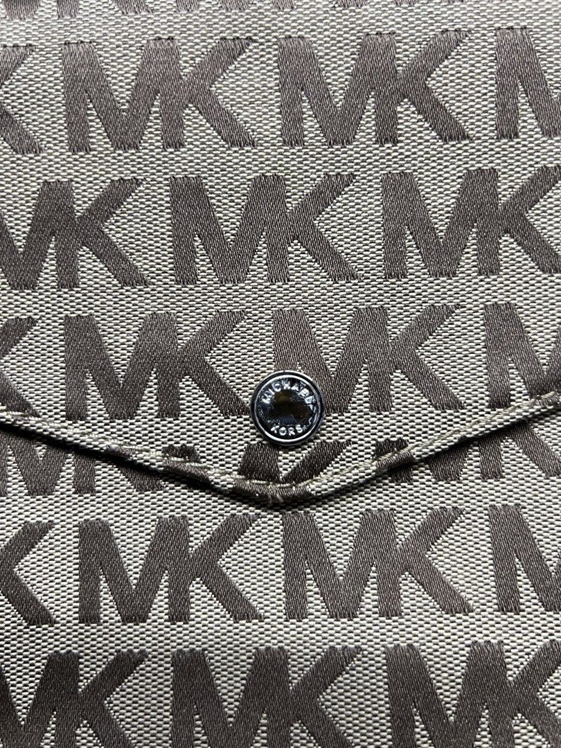 Michael Kors Monogram Tote Bag Brown Beige (Category: Luxury Bags & Wallets) located in Manila. Submitted by apoltree (Listing ID 1468446122, Image 2). Description: - Brand: Michael Kors - Material: Classic beige canvas with brown leather trim - Design: Iconic MK monogram print all over with gold-tone hardware - Features: Adjustable buckle straps, front slip pocket with button snap closure - Interior: Spacious main compartment, perfect for everyd