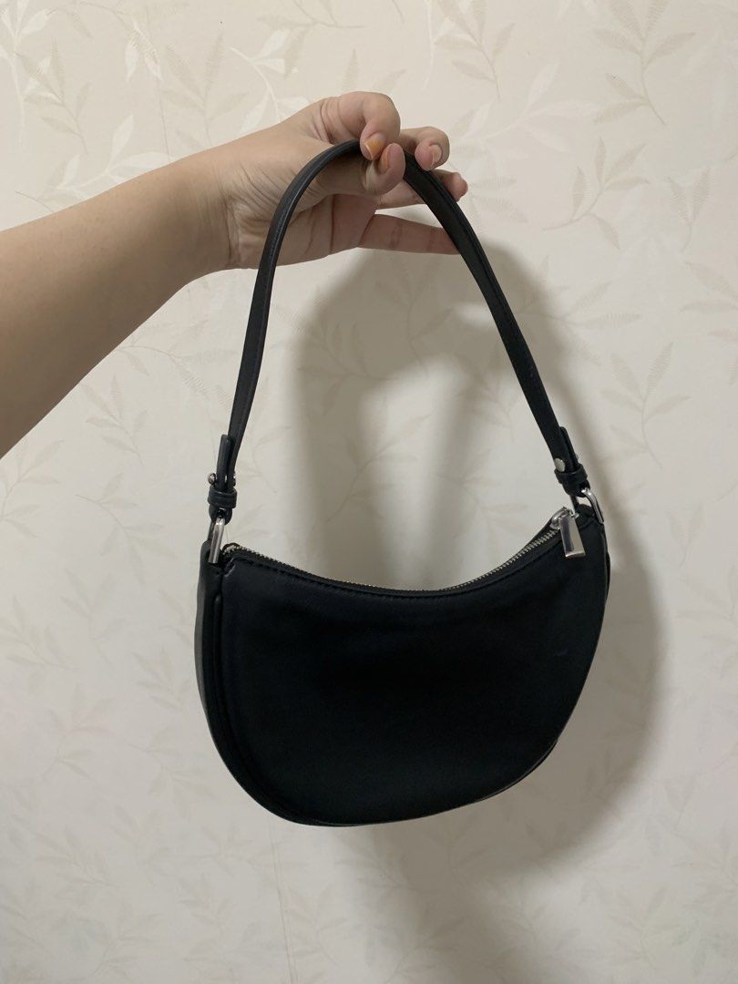 Michael Kors Small Convertible Pochette Black (Category: Luxury Bags & Wallets) located in Makati City. Submitted by FashionFactory (Listing ID 1468369478, Image 2). Description: - Authentic Michael Kors black leather shoulder bag - Sleek silver hardware with front MK logo lettering - Versatile 2-in-1 design: converts from a short pochette to a crossbody using detachable straps - Interior pocket features official Michael Kors branding label - Com