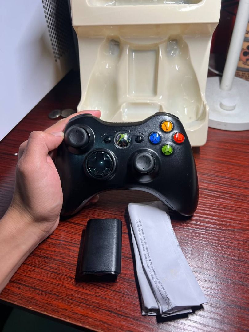 Microsoft Xbox 360 Wireless Controller Black with Box (AUTHENTIC) (Category: Controllers) located in Baguio. Submitted by carlbenta (Listing ID 1468426559, Image 3). Description: - Original black wireless controller for Xbox 360 console - Up to 30 feet operating range - Standard button layout with classic colorful action buttons - Clean condition overall - Includes battery pack housing, manual paper insert, and original retail box - Boxed up and 
