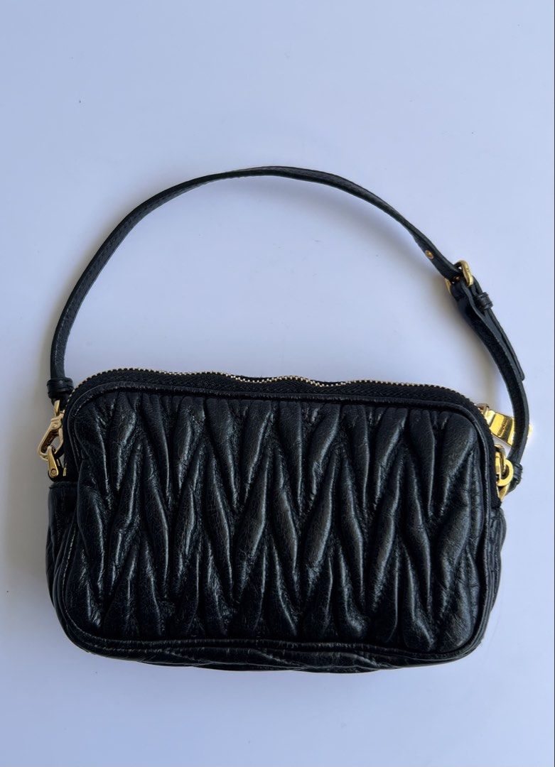 MIU MIU - MATELASŠE LEATHER MINI POCHETTE BAG (Category: Luxury Bags & Wallets) located in Cavite. Submitted by _Gizmo (Listing ID 1468372485, Image 3). Description: Miu Miu - Matellassé Leather Mini Pochette Bag Wrist strap can be worn multiple ways, as a wristlet, as a handle, or around a bigger purse as a cute bag charm. Measurement Width: 6’ Inch Height: 3.5’ Inch Depth: 1.5’ Inch Sling drop: 4.5’ Inch Condition: Rank A No flaws Made In Turke