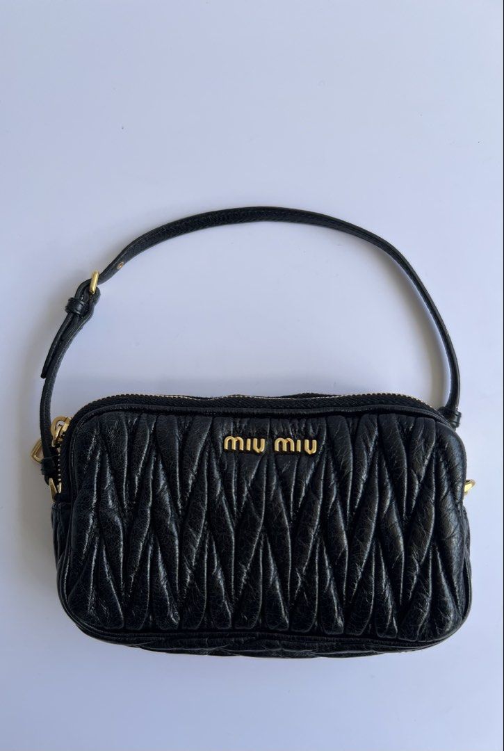 MIU MIU - MATELASŠE LEATHER MINI POCHETTE BAG (Category: Luxury Bags & Wallets) located in Cavite. Submitted by _Gizmo (Listing ID 1468372485, Image 1). Description: Miu Miu - Matellassé Leather Mini Pochette Bag Wrist strap can be worn multiple ways, as a wristlet, as a handle, or around a bigger purse as a cute bag charm. Measurement Width: 6’ Inch Height: 3.5’ Inch Depth: 1.5’ Inch Sling drop: 4.5’ Inch Condition: Rank A No flaws Made In Turke
