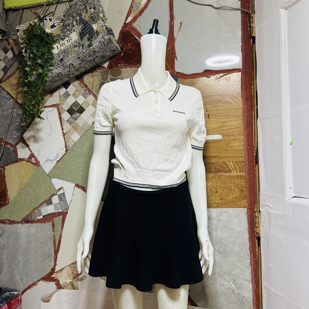 Miu miu knit top (Category: Luxury Apparel) located in Baguio. Submitted by kckc_luxury (Listing ID 1468401747, Image 2). Description: 🌸 TINY PINK SPOTS ARE LENS DAMAGE, NOT CLOTH STAINS ————————— ❗️KINDLY READ BEFORE MAKING AN OFFER❗️ LISTING DETAILS size:S-M width x length (inches):21x18 condition: Good conditions --- MOP: Gcash / BPI MOD: J&T / JRS LOCATION: Baguio City --- NOTE: • Manage your expectations • Photos did not go under any edit b