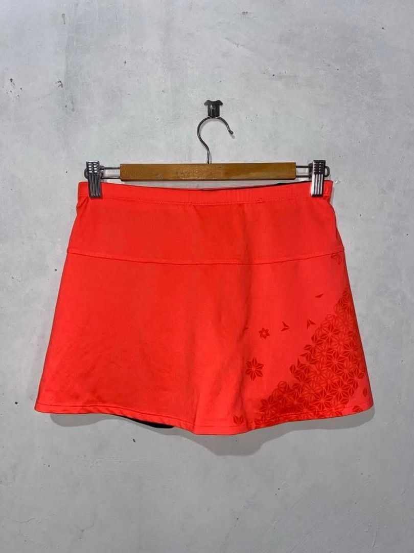 Mizuno Drylite Running Skort Size Medium (Category: Activewear) located in Meycauayan. Submitted by epicforest_231b9d (Listing ID 1468395700, Image 3). Description: - Brand: Mizuno - Type: Running skort with built-in black cycling shorts - Color/Pattern: Bright orange with geometric flower print on the lower right and back - Size: Medium (Japan engineered) - Features: Lightweight Drylite performance fabric and reflective Mizuno logo - Condition: 