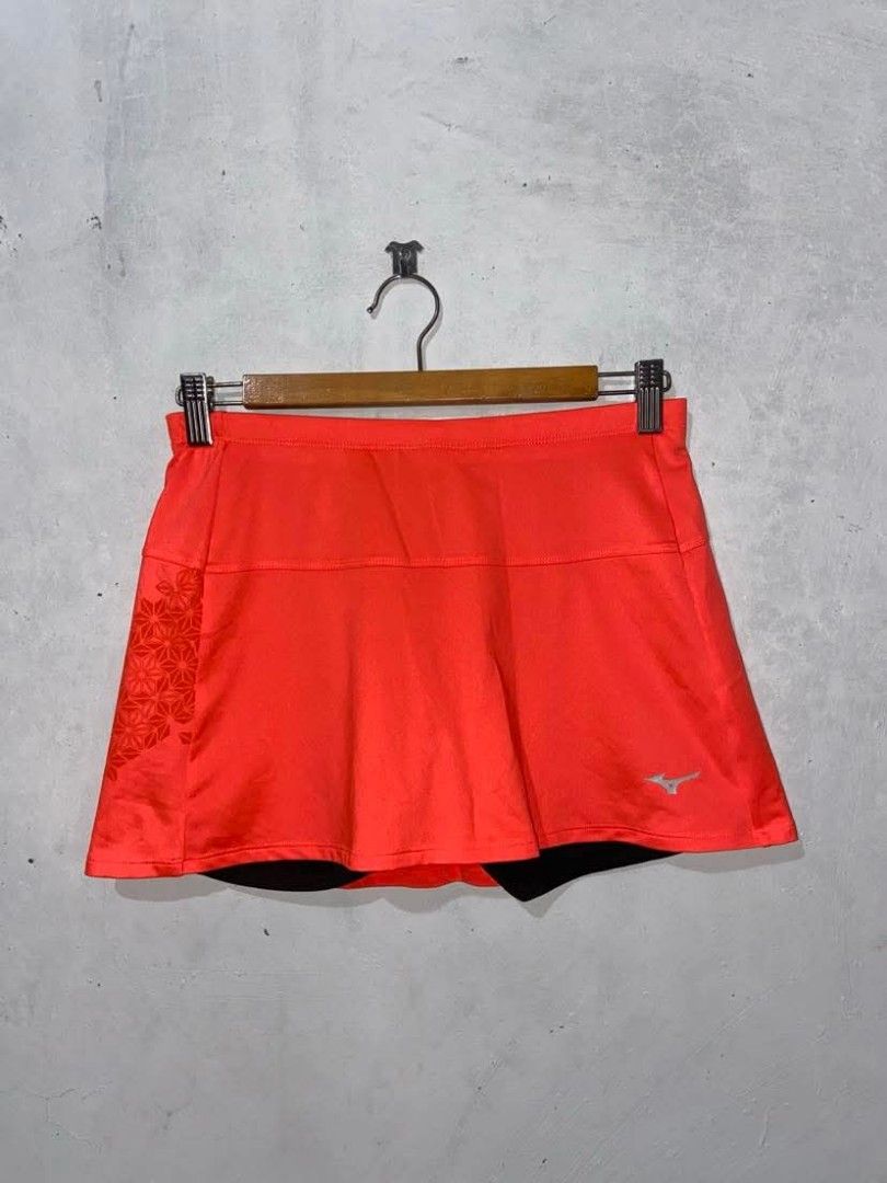Mizuno Drylite Running Skort Size Medium (Category: Activewear) located in Meycauayan. Submitted by epicforest_231b9d (Listing ID 1468395700, Image 2). Description: - Brand: Mizuno - Type: Running skort with built-in black cycling shorts - Color/Pattern: Bright orange with geometric flower print on the lower right and back - Size: Medium (Japan engineered) - Features: Lightweight Drylite performance fabric and reflective Mizuno logo - Condition: 