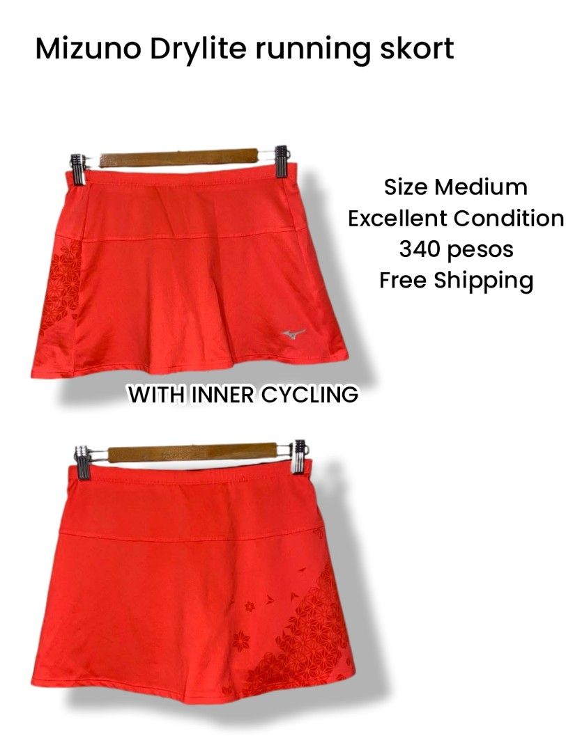 Mizuno Drylite Running Skort Size Medium (Category: Activewear) located in Meycauayan. Submitted by epicforest_231b9d (Listing ID 1468395700, Image 1). Description: - Brand: Mizuno - Type: Running skort with built-in black cycling shorts - Color/Pattern: Bright orange with geometric flower print on the lower right and back - Size: Medium (Japan engineered) - Features: Lightweight Drylite performance fabric and reflective Mizuno logo - Condition: 