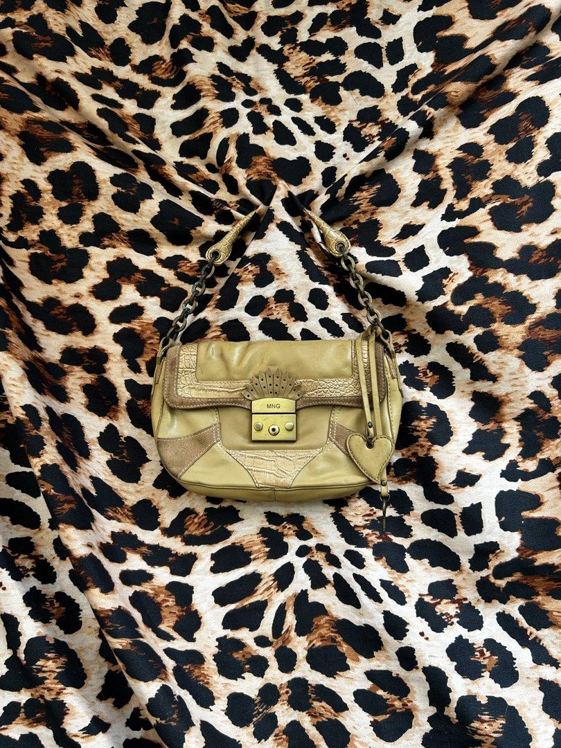 MNG khaki brown shoulder bag with chain strap (Category: Shoulder Bags) located in Los Banos. Submitted by samsukehiro (Listing ID 1468380808, Image 1). Description: - Brand: MNG - Color: Khaki brown - Material/Texture: Mixed textures with smooth leather, suede patches, and embossed croc detailing - Hardware & Accents: Antique brass-tone front lock with MNG stamp and a charming hanging heart charm - Strap: Combination chain and leather strap - De