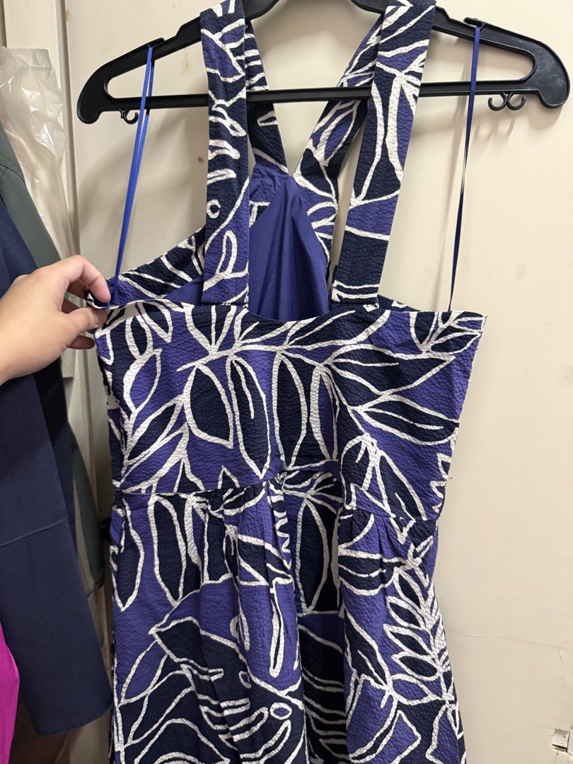 MNG Purple Leaf Print Halter Dress Size Medium (Category: Dresses) located in Quezon City. Submitted by mikaela_0 (Listing ID 1468356496, Image 3). Description: - Brand: Mango - Size: Medium, fits small to medium - Design: Purple & blue tropical leaf pattern with a chic open back and crossover straps - Material: Textured seersucker fabric - Fit: Cinched elastic waist for a flattering silhouette Excellent condition.