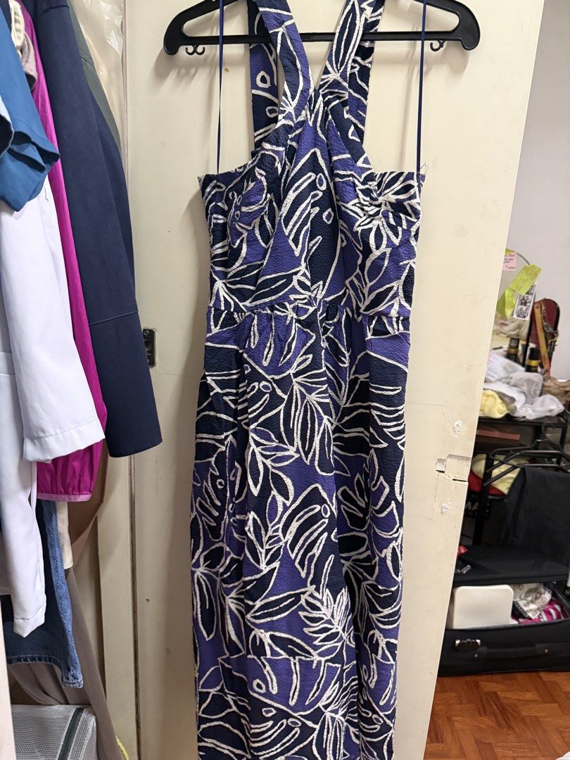MNG Purple Leaf Print Halter Dress Size Medium (Category: Dresses) located in Quezon City. Submitted by mikaela_0 (Listing ID 1468356496, Image 1). Description: - Brand: Mango - Size: Medium, fits small to medium - Design: Purple & blue tropical leaf pattern with a chic open back and crossover straps - Material: Textured seersucker fabric - Fit: Cinched elastic waist for a flattering silhouette Excellent condition.