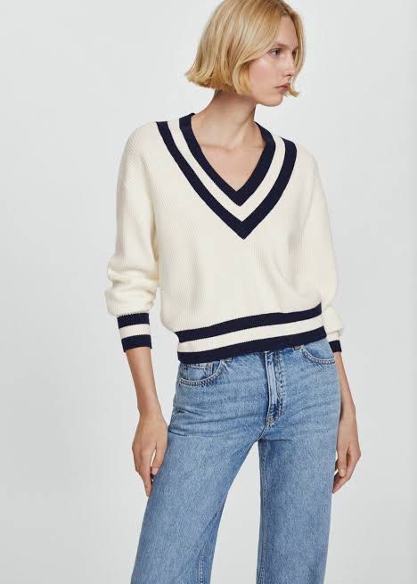 MNG White V-Neck Cricket Sweater (Category: Longsleeves) located in Angeles City. Submitted by reginageorge22 (Listing ID 1468329506, Image 2). Description: - Style: Classic preppy look with white knit and navy blue stripes - Details: V-neck, cuffs, and hem accents with ribbed texture - Fit: Relaxed fit, Tag size L - Perfect for: Cooler weather staple piece See photos re minor flaws I'm usually a size small kaso I like this sweater a lot pero lag
