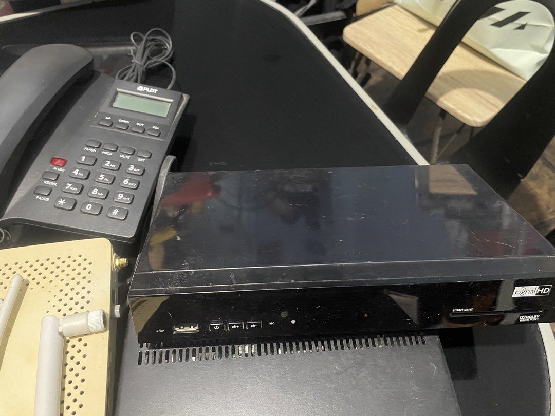Modem Router (Category: Computer Parts) located in Binan City. Submitted by winds06 (Listing ID 1468322149, Image 2). Description: Take all. Digi Box Cignal receiver, PLDT handset, PlDT Modem Router. Actually 3 ang cignal box receiver..