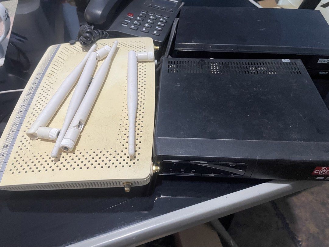 Modem Router (Category: Computer Parts) located in Binan City. Submitted by winds06 (Listing ID 1468322149, Image 1). Description: Take all. Digi Box Cignal receiver, PLDT handset, PlDT Modem Router. Actually 3 ang cignal box receiver..