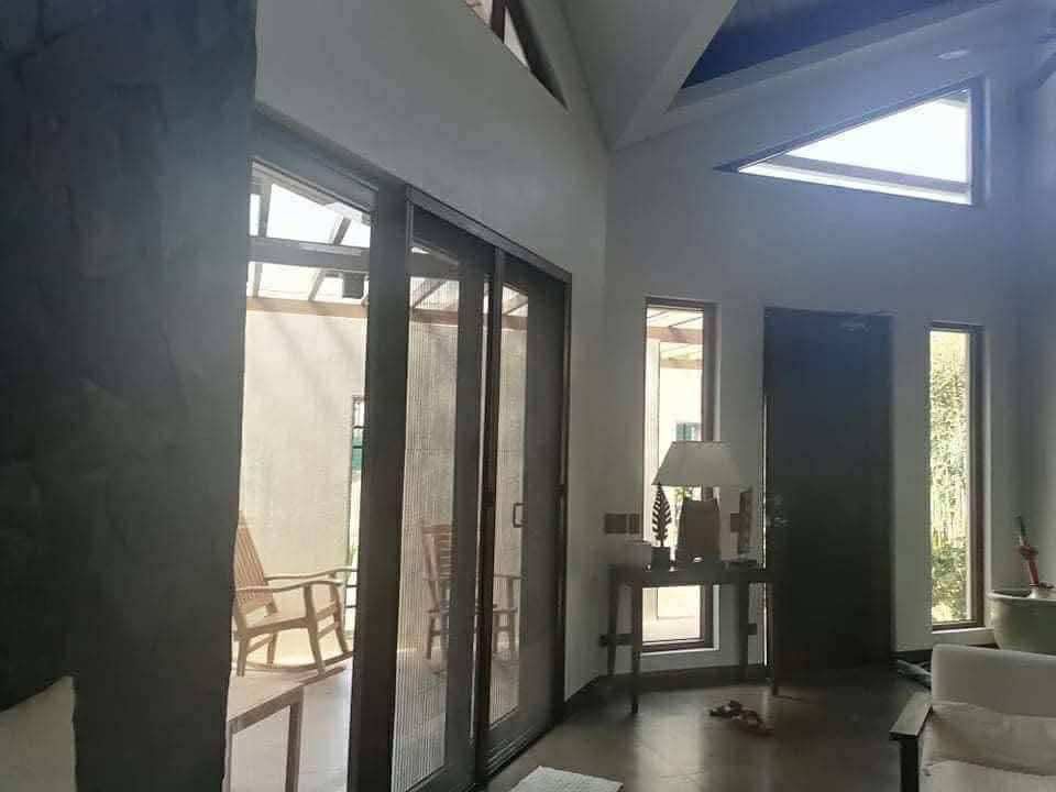 Modern Tropical Architectural House with Stone Walls (Category: House & Lot) located in Manila. Submitted by goddesssy (Listing ID 1468321822, Image 2). Description: For SALE 26M nett ( negotiable) House at TAGO by Arch Manosa Location Tagaytay Complete title and papers ready to transfer Fully Furnished house All furniture & fixture included 3 bedrooms with bathroom on each 1 maids quarter Living room Guest area Landscaped garden 390 sqm PM for m