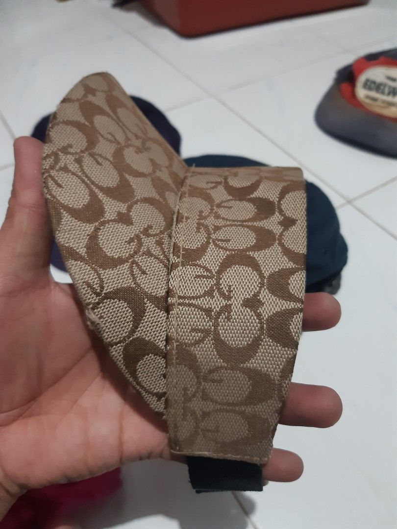 Monogram Pattern Sun Visor Cap Polyester (Category: Cap & Hats) located in Klang. Submitted by silent.ali_jamaludin (Listing ID 1468390993, Image 2). Description: - Stylish brown monogram pattern all over - Adjustable black strap at the back for a custom fit - Material: 100% polyester - Condition note: Some loose threads around the brim edge - Perfect for outdoor days, sunny weather, or casual streetwear -bundle -rm 40 -cod meru klang 0173684540 