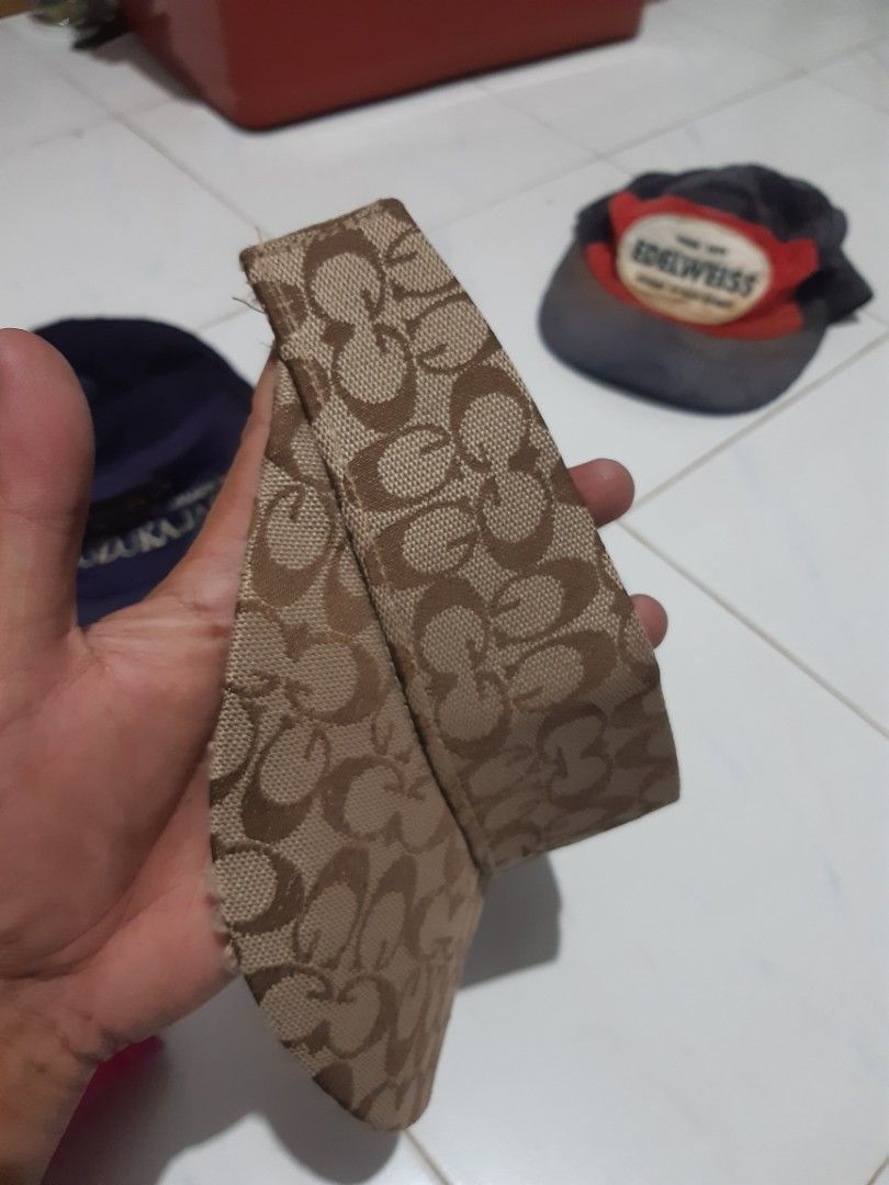 Monogram Pattern Sun Visor Cap Polyester (Category: Cap & Hats) located in Klang. Submitted by silent.ali_jamaludin (Listing ID 1468390993, Image 3). Description: - Stylish brown monogram pattern all over - Adjustable black strap at the back for a custom fit - Material: 100% polyester - Condition note: Some loose threads around the brim edge - Perfect for outdoor days, sunny weather, or casual streetwear -bundle -rm 40 -cod meru klang 0173684540 