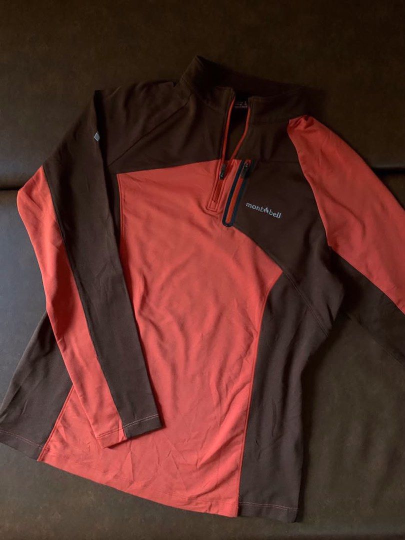 Montbell Quarter-Zip Fleece (Category: Coats, Jackets and Outerwear) located in Iloilo. Submitted by astaaa777 (Listing ID 1468322025, Image 1). Description: - Brand: Montbell - Style: Quarter-zip pullover midlayer - Color: Brown and orange color blocking - Material: Warm grid fleece on upper body and collar - Features: Zipped chest pocket with embroidered Montbell logo - Condition: Excellent outdoor wear - Perfect for: Hiking, camping, and cold-