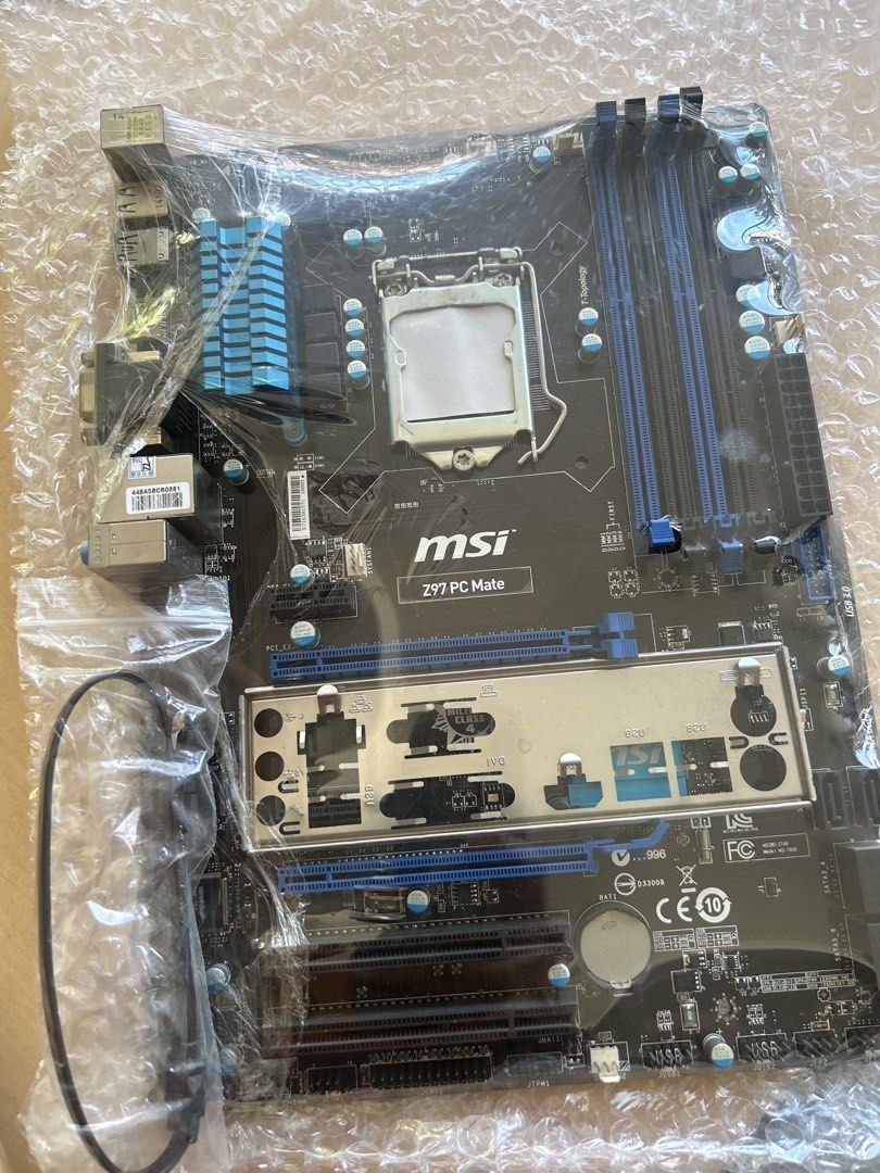 MSI Z97 PC Mate Motherboard (Category: Computer Parts) located in Manila. Submitted by eeerk (Listing ID 1468331592, Image 1). Description: - Model: MSI Z97 PC Mate motherboard - Socket: LGA 1150 - Memory: 4x DDR3 RAM slots - Design: Stylish blue accent heatsinks - Inclusions: I/O shield (taped on front) and 1x SATA cable - Condition: Sealed in protective plastic wrap and bubble wrap and box - Ideal for budget gaming or reliable PC builds.