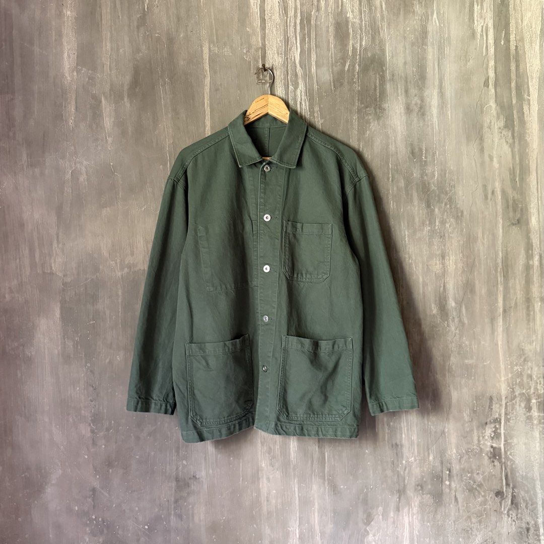 MUJI Utility Workwear Chore Jacket (Category: Coats, Jackets and Outerwear) located in Puerto Princesa. Submitted by terdsthrift (Listing ID 1468423557, Image 1). Description: MUJI Utility Workwear Chore Jacket Width: 24 Length: 29 Shoulder: 21 In Good Condition / No Issue Color Rate: 9/10 - Color: Olive green - Size: Medium - Material: Heavy twill cotton - Pockets: Four front patch pockets, one single chest pocket - Closure: Metal buttons with a