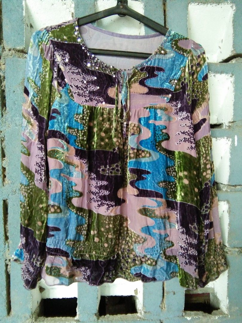Multicolor Velvet Blouse with Sequin Details and Long Sleeves (Category: Longsleeves) located in Meycauayan. Submitted by pau.trading (Listing ID 1468306822, Image 1). Description: - Multicolor velvet blouse with a vibrant abstract pattern (blue, green, purple, pink) - Long sleeves with trendy ruffled cuffs - Scoop neckline with a tie-string and delicate sequin embellishments - Smocked hemline for a comfortable and fitted waistline - Lightweight,