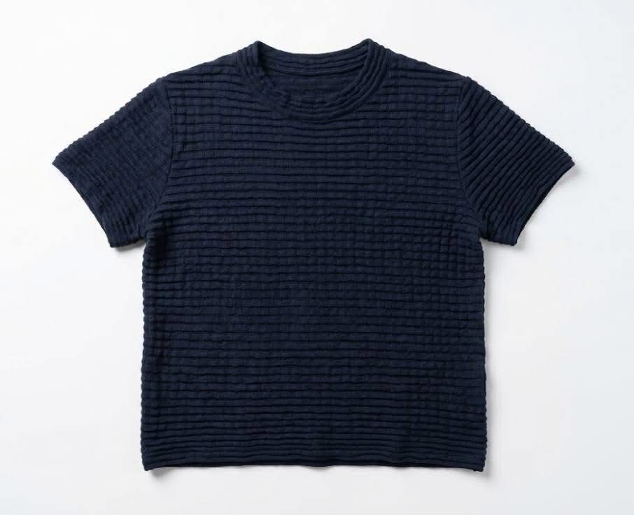 Navy Blue Textured Short Sleeve Knit Top (Category: Blouses) located in Donsol. Submitted by saksthriftavenuebyluckymaria8 (Listing ID 1468461388, Image 2). Description: - Color: Dark blue - Style: Short sleeve knit top with crew neckline and relaxed fit - Details: Subtle horizontal ribbed texture with tiny sparkling threads woven throughout - Versatility: Easy to pair with both jeans and trousers Dark navy textured short-sleeve crewneck top sz L