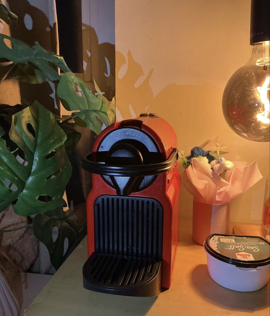 Nespresso Inissia Coffee Machine Red (Category: Coffee Machines & Makers) located in Quezon City. Submitted by elleskyer (Listing ID 1468299102, Image 1). Description: - Color: Bright red with black drip tray and lever - Design: Compact size, ideal for small kitchen counters - Performance: Works great, heats up fast for quick morning espresso shots - Maintenance: Easy-to-clean water tank located at the back - Power: Standard power plug included -