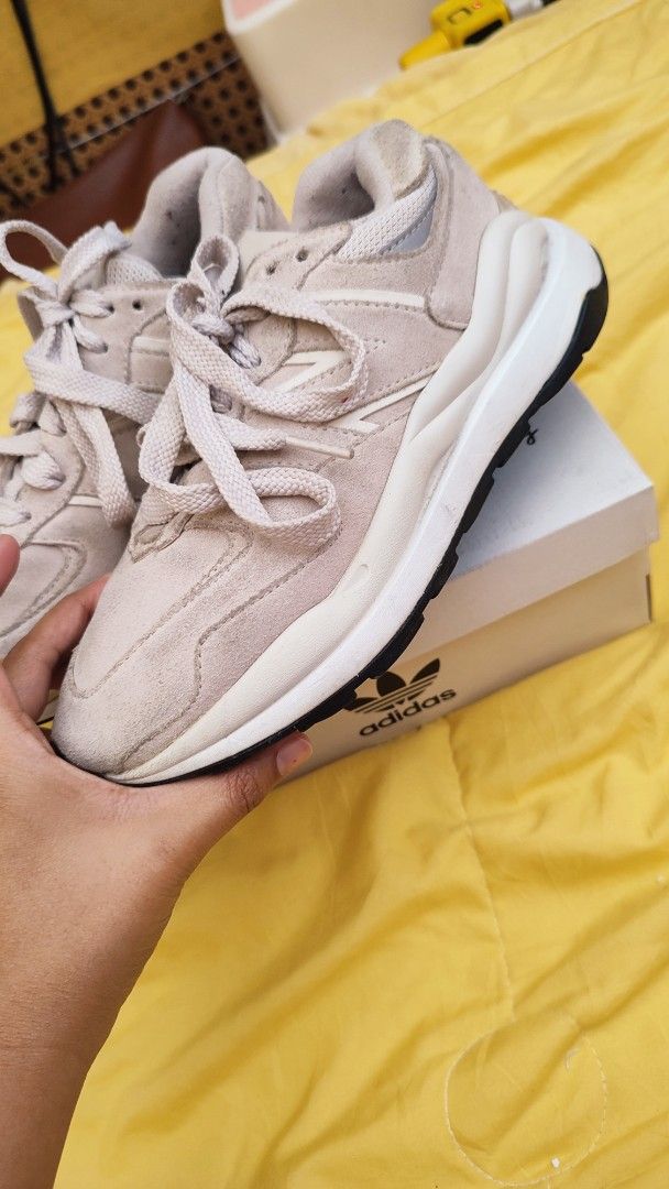 New Balance 574 Light Beige Sneakers (Category: Sneakers) located in Manila. Submitted by anez06 (Listing ID 1468351350, Image 3). Description: - Color/Material: Beige suede with chunky white midsoles - Style: Classic lace-up with signature 'N' side branding - Versatility: Neutral shade easily pairs with casual outfits - Condition: Gentle wear on suede and soles from normal use.