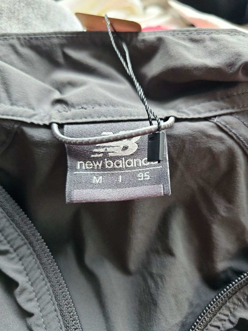 New Balance short-sleeve half-zip anorak (Category: Tshirts & Polo Shirts ) located in Baguio. Submitted by kayeonlineshop (Listing ID 1468307574, Image 3). Description: -charcoal gray New Balance short-sleeve half-zip anorak or windbreaker jacket with a standing collar and front pockets..
