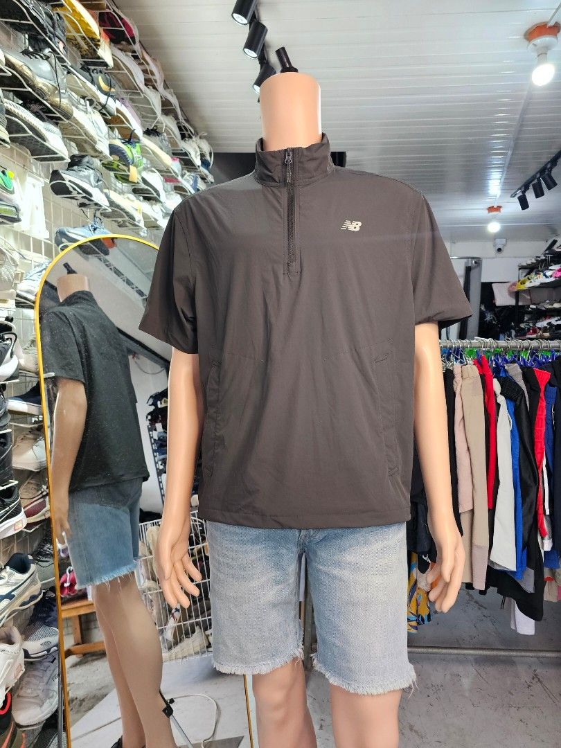 New Balance short-sleeve half-zip anorak (Category: Tshirts & Polo Shirts ) located in Baguio. Submitted by kayeonlineshop (Listing ID 1468307574, Image 1). Description: -charcoal gray New Balance short-sleeve half-zip anorak or windbreaker jacket with a standing collar and front pockets..