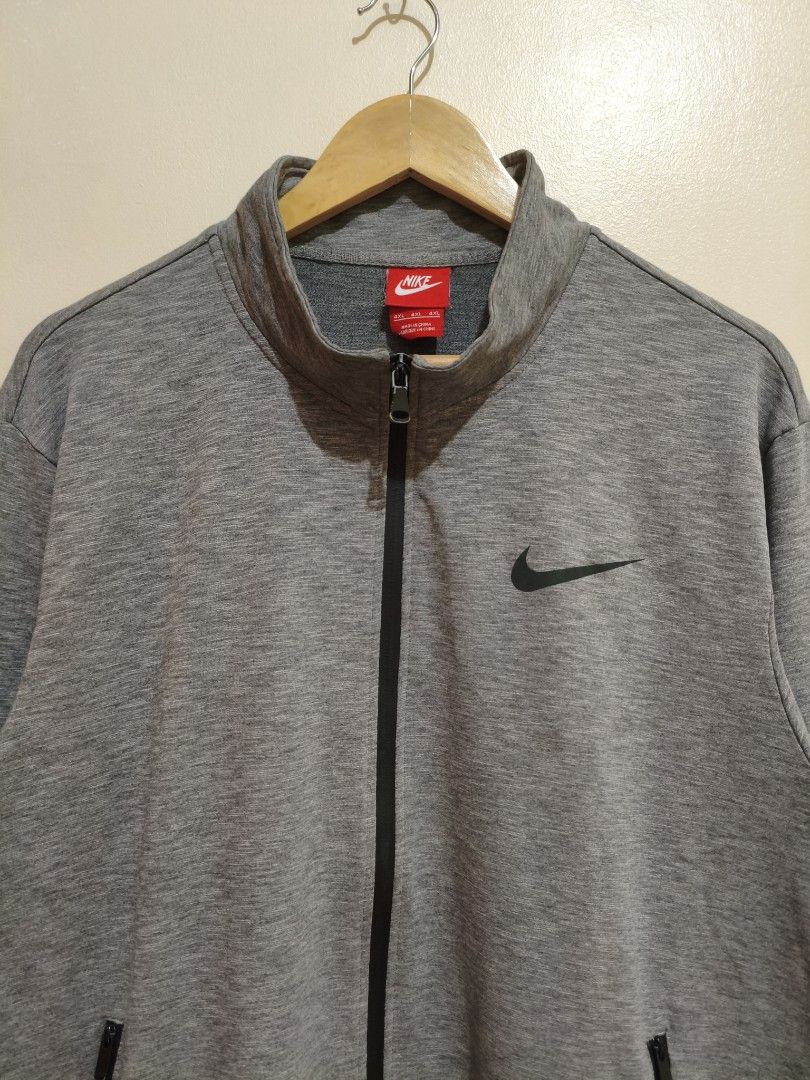 Nie Gray Full-Zip Track Jacket (Category: Coats, Jackets and Outerwear) located in Mandaluyong City. Submitted by frivsthriftsph (Listing ID 1468449277, Image 3). Description: Nike Gray Full-Zip Track Jacket Like new condition. Color rate is 10/10. Size 4XL on tag. Actual dimes are 23W by 27L. No other issue aside from right pocket zipper (di masara)..