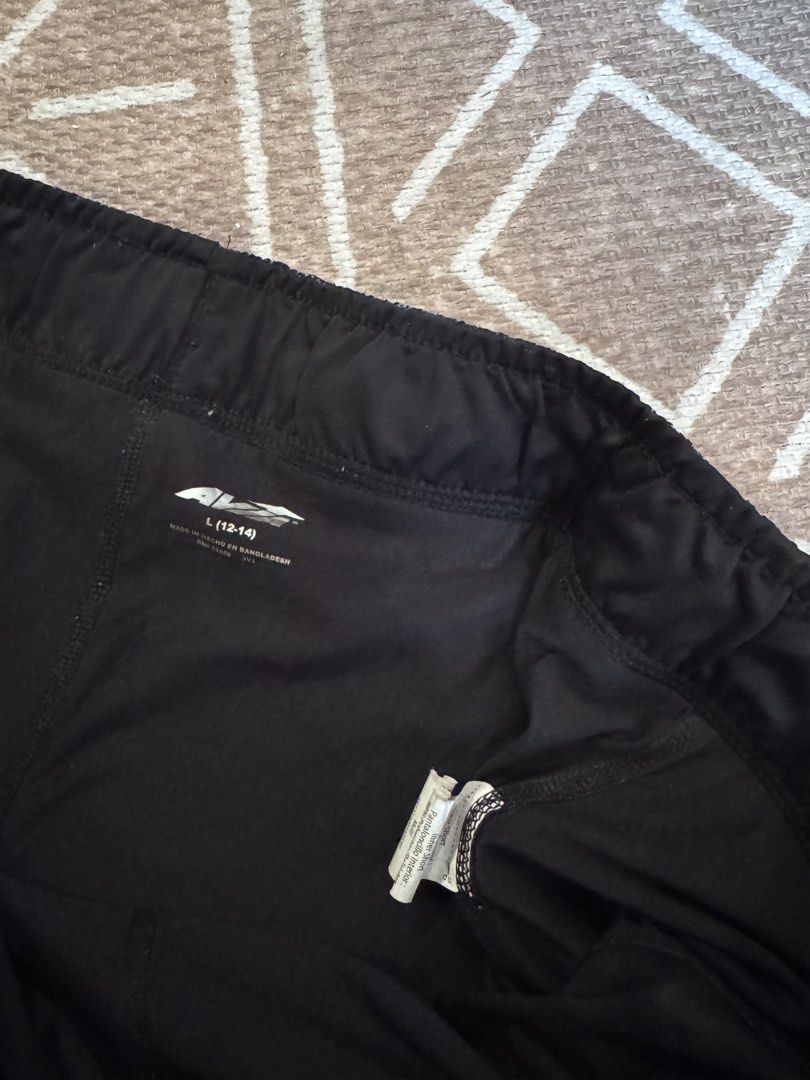 Nike and Avia athletic shorts bundle size L (Category: Shorts) located in Bulacan. Submitted by zyannechlo86360 (Listing ID 1468413421, Image 3). Description: Two pairs of athletic shorts. One pair is Nike with a star pattern and white drawstring waist. Second pair is Avia with a dark floral and abstract pattern, inner lining included. Both shorts feature elastic waistbands. Great for workouts, running, or casual gym wear. Size L for kids or yout