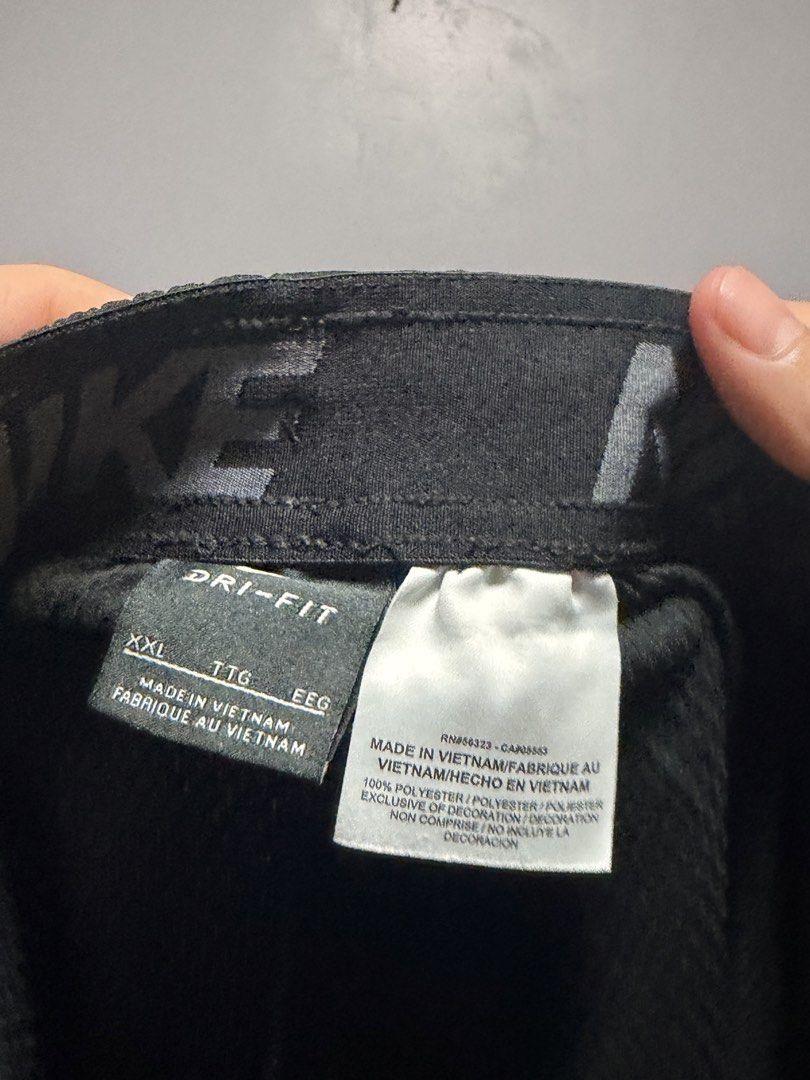 Nike Athletic Shorts Black with Side Graphic (Category: Shorts) located in Manila. Submitted by swiftgem.eeb06e (Listing ID 1468390244, Image 3). Description: - Color: Black - Brand/Logo: Large grey Nike graphic on lower left leg - Waist: Elastic waistband with adjustable drawstring - Material: Lightweight and breathable - Ideal for: Workouts, running, or casual wear - Fit: Standard fit - Condition: Clean, pre-loved condition overall - Dimes: 17x