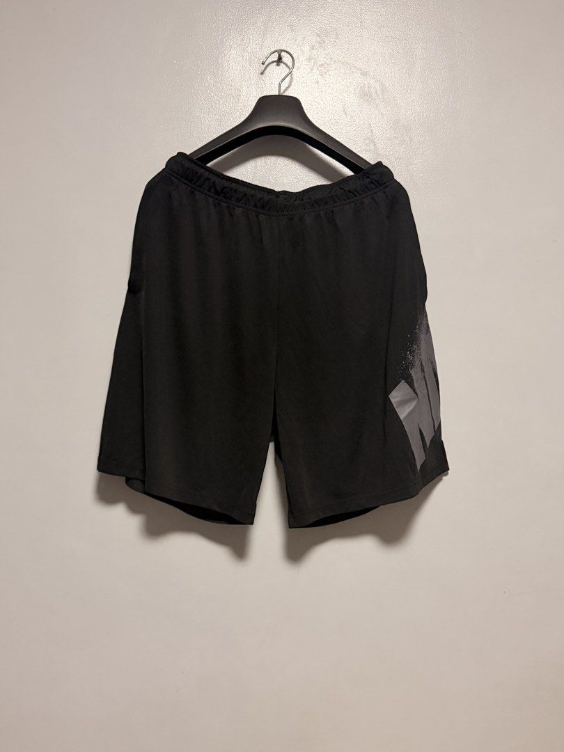 Nike Athletic Shorts Black with Side Graphic (Category: Shorts) located in Manila. Submitted by swiftgem.eeb06e (Listing ID 1468390244, Image 1). Description: - Color: Black - Brand/Logo: Large grey Nike graphic on lower left leg - Waist: Elastic waistband with adjustable drawstring - Material: Lightweight and breathable - Ideal for: Workouts, running, or casual wear - Fit: Standard fit - Condition: Clean, pre-loved condition overall - Dimes: 17x