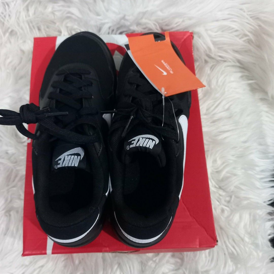 Nike Black and White Sneakers with Box (Category: Sneakers) located in Cavite. Submitted by tobias_7795 (Listing ID 1468443217, Image 1). Description: - Brand: Nike - Style: Low-top sneakers with lace-up closure - Colorway: Classic black and white with white swoosh - Features: Textured black rubber outsole for grip, branding on tongue and heel - Condition: Brand new with tags attached - Packaging: Original red shoebox included.