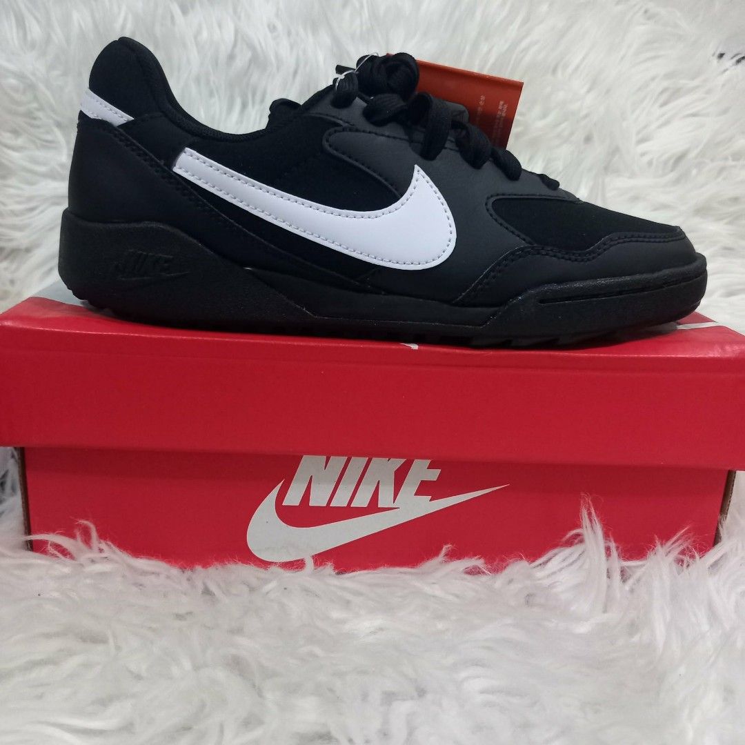 Nike Black and White Sneakers with Box (Category: Sneakers) located in Cavite. Submitted by tobias_7795 (Listing ID 1468443217, Image 2). Description: - Brand: Nike - Style: Low-top sneakers with lace-up closure - Colorway: Classic black and white with white swoosh - Features: Textured black rubber outsole for grip, branding on tongue and heel - Condition: Brand new with tags attached - Packaging: Original red shoebox included.