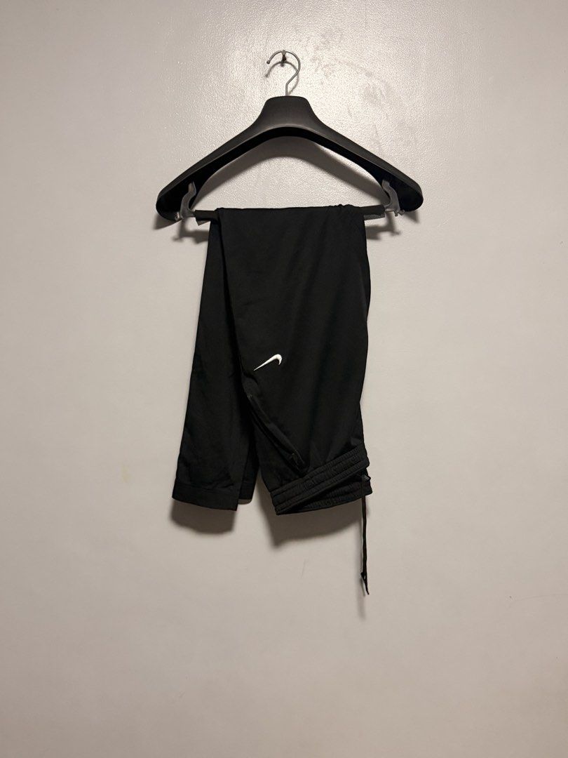 Nike Black Athletic Pants (Category: Joggers) located in Manila. Submitted by swiftgem.eeb06e (Listing ID 1468390235, Image 1). Description: - Brand: Nike - Color: Classic Black with White Swoosh logo - Material: Smooth, lightweight athletic fabric - Features: Drawstring waist for an adjustable fit, ribbed cuffs at the bottom hems - Condition: Clean, excellent, and ready to wear - Versatility: Ideal for gym workouts, running, or casual lounging -