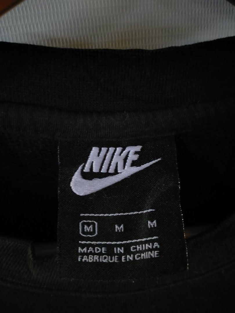 Nike Black Sweatshirt BV2667-010 Size M (Category: Coats, Jackets and Outerwear) located in Davao. Submitted by ervinpolino09 (Listing ID 1468289077, Image 3). Description: - Brand: Nike - Item: Black crewneck sweatshirt - Size: Medium (Standard fit) - Style Code: BV2667-010 - Material: 80% cotton, 20% polyester blend - Design: Classic white embroidered swoosh logo on chest with ribbed collar, cuffs, and hem - Condition: Clean piece, perfect for 