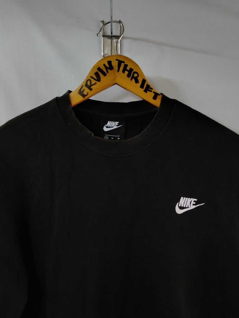 Nike Black Sweatshirt BV2667-010 Size M (Category: Coats, Jackets and Outerwear) located in Davao. Submitted by ervinpolino09 (Listing ID 1468289077, Image 2). Description: - Brand: Nike - Item: Black crewneck sweatshirt - Size: Medium (Standard fit) - Style Code: BV2667-010 - Material: 80% cotton, 20% polyester blend - Design: Classic white embroidered swoosh logo on chest with ribbed collar, cuffs, and hem - Condition: Clean piece, perfect for 