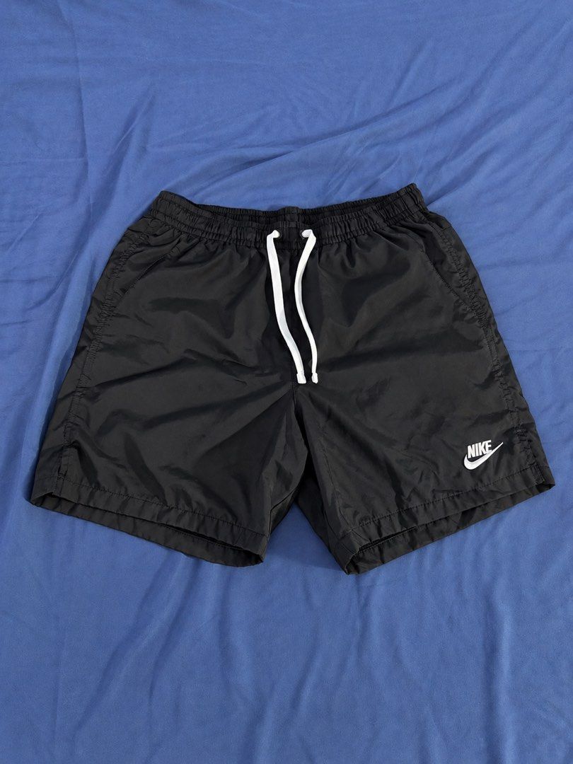 Nike Black Swim Shorts with White Drawstrings (Category: Shorts) located in Manila. Submitted by throughhim (Listing ID 1468461314, Image 1). Description: - Color: Classic Black with White details - Size: Medium (tag inside waistband) - Brand: Nike (small white logo near hem) - Features: Adjustable white drawstring, inner mesh lining, and a back pocket with a metal drainage eyelet - Origin: Made in Vietnam - Condition: Excellent, ready to wear.