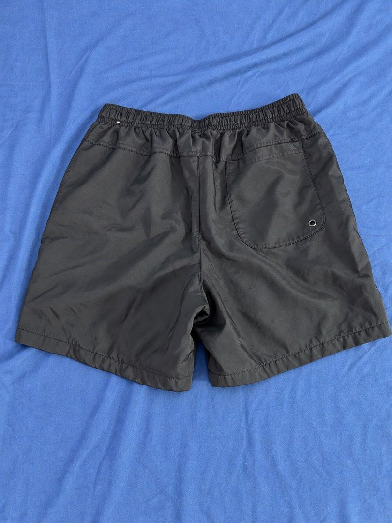 Nike Black Swim Shorts with White Drawstrings (Category: Shorts) located in Manila. Submitted by throughhim (Listing ID 1468461314, Image 2). Description: - Color: Classic Black with White details - Size: Medium (tag inside waistband) - Brand: Nike (small white logo near hem) - Features: Adjustable white drawstring, inner mesh lining, and a back pocket with a metal drainage eyelet - Origin: Made in Vietnam - Condition: Excellent, ready to wear.