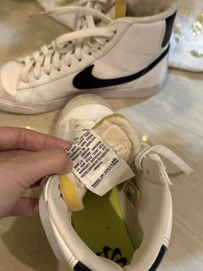 Nike Blazer Mid '77 Vintage White Black (Category: Sneakers) located in Manila. Submitted by hearty.y (Listing ID 1468411905, Image 2). Description: - Brand/Model: Nike Blazer Mid '77 Vintage - Colorway: White leather upper with iconic black swoosh - Details: Suede overlays at the toe, exposed foam tongue with vintage branding, and vibrant lime green insoles - Fit: Classic high-top profile with standard lace-up closure - Condition: Pre-owned with