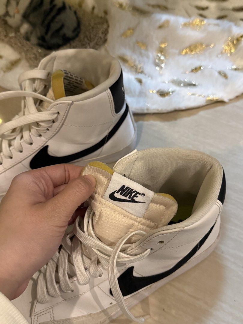 Nike Blazer Mid '77 Vintage White Black (Category: Sneakers) located in Manila. Submitted by hearty.y (Listing ID 1468411905, Image 1). Description: - Brand/Model: Nike Blazer Mid '77 Vintage - Colorway: White leather upper with iconic black swoosh - Details: Suede overlays at the toe, exposed foam tongue with vintage branding, and vibrant lime green insoles - Fit: Classic high-top profile with standard lace-up closure - Condition: Pre-owned with