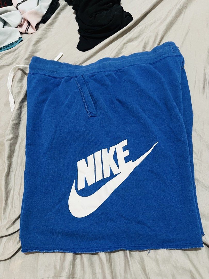 Nike Blue Men's Shorts Size XL (Category: Shorts) located in Manila. Submitted by athan0800 (Listing ID 1468284628, Image 1). Description: - Brand/Model: Nike Shorts - Color: Bright Blue with large white logo - Size: XL - Material: Cotton and polyester blend - Features: Elastic waistband, white drawstring, side pockets - Origin: Made in Thailand.