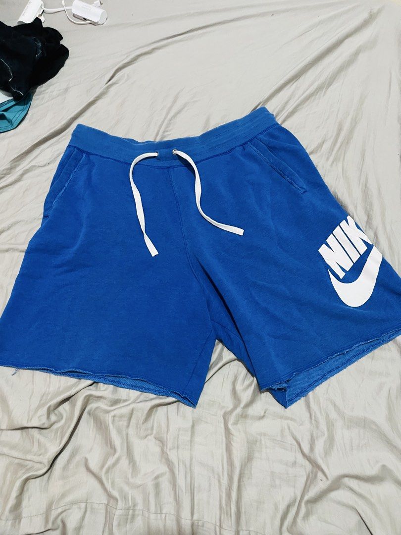 Nike Blue Men's Shorts Size XL (Category: Shorts) located in Manila. Submitted by athan0800 (Listing ID 1468284628, Image 2). Description: - Brand/Model: Nike Shorts - Color: Bright Blue with large white logo - Size: XL - Material: Cotton and polyester blend - Features: Elastic waistband, white drawstring, side pockets - Origin: Made in Thailand.