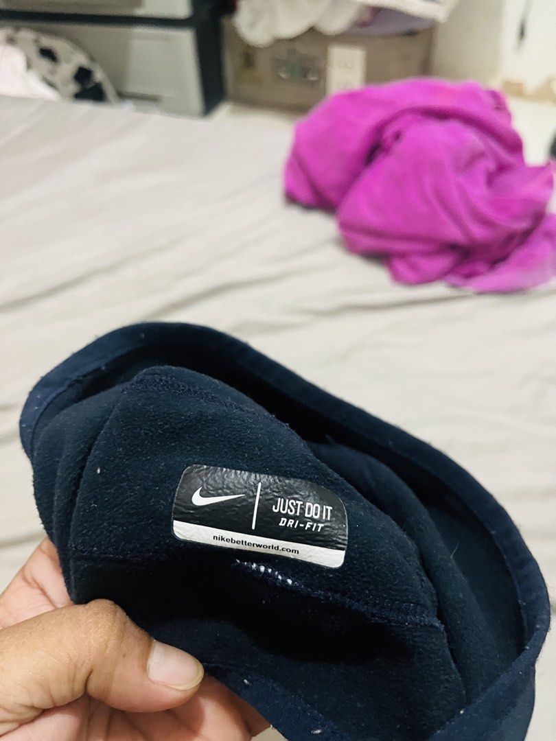 Nike Dri-Fit Navy Blue Beanie Cap (Category: Caps & Hats) located in Manila. Submitted by athan0800 (Listing ID 1468284522, Image 3). Description: - Authentic Nike Dri-Fit cap in navy blue - Features classic swoosh logo on the front and reflective stripes on the sides - Moisture-wicking fabric keeps your head warm and dry during runs and outdoor workouts - Interior tag features the iconic 'Just Do It' mantra and nikebetterworld.com - Perfect for 