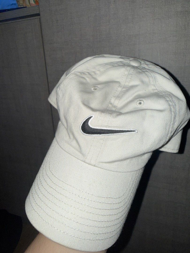 NIKE HERITAGE86 SWOOSH CAP – WHITE / BLACK (Category: Caps & Hats) located in Las Pinas. Submitted by coolthreadz (Listing ID 1468402761, Image 1). Description: 🧢 NIKE HERITAGE86 SWOOSH CAP – WHITE / BLACK 🏷️ Brand: Nike 🧢 Style: Heritage86 Adjustable Baseball Cap 🎨 Color: Off-White / Black 📏 Size: One Size (Adjustable) 🧵 Material: 100% Cotton ✨ Condition: Very Good / Preloved * Classic Nike Heritage86 cap featuring an embroidered black Swo