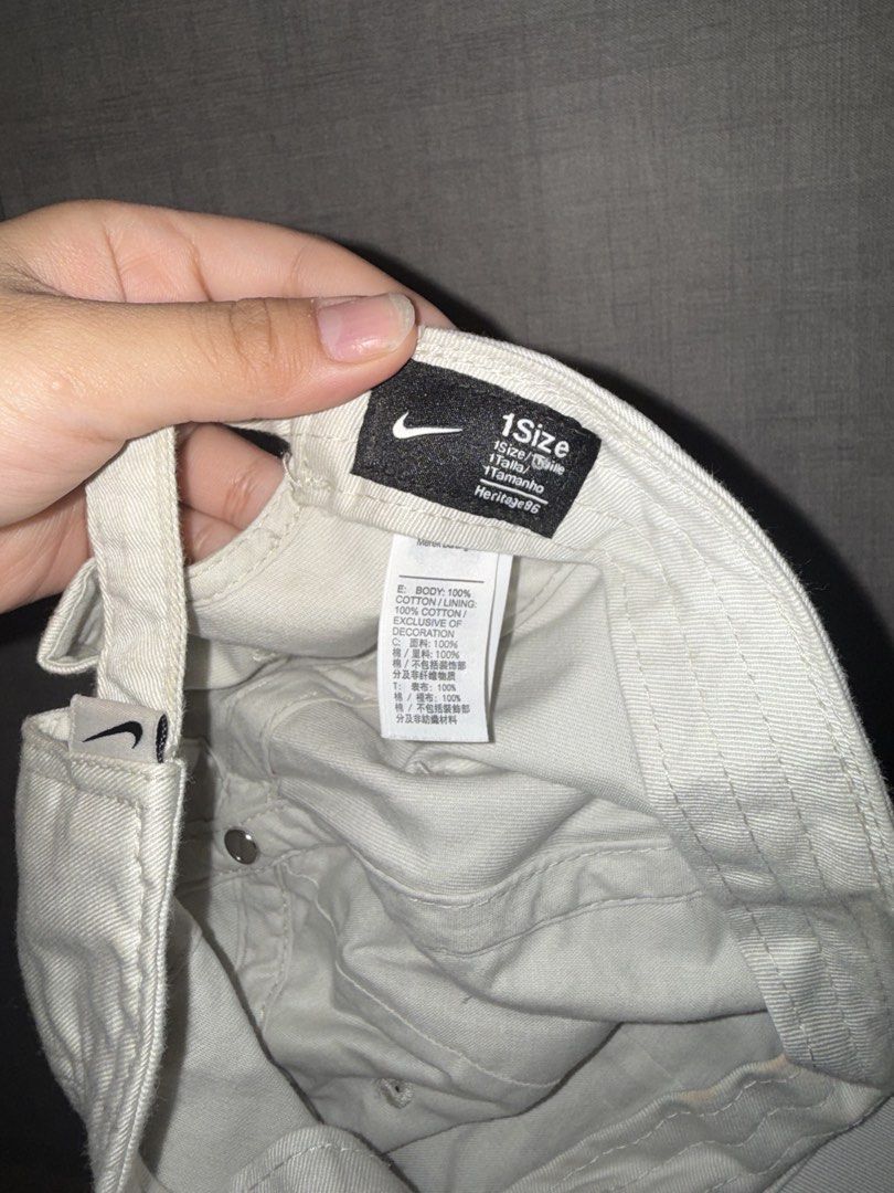 NIKE HERITAGE86 SWOOSH CAP – WHITE / BLACK (Category: Caps & Hats) located in Las Pinas. Submitted by coolthreadz (Listing ID 1468402761, Image 2). Description: 🧢 NIKE HERITAGE86 SWOOSH CAP – WHITE / BLACK 🏷️ Brand: Nike 🧢 Style: Heritage86 Adjustable Baseball Cap 🎨 Color: Off-White / Black 📏 Size: One Size (Adjustable) 🧵 Material: 100% Cotton ✨ Condition: Very Good / Preloved * Classic Nike Heritage86 cap featuring an embroidered black Swo