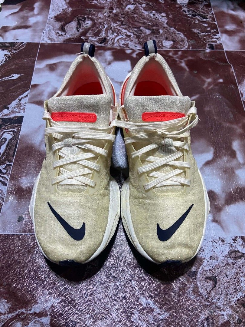 Nike Invincible Run 3 ZoomX Flyknit Cream (Category: Sneakers) located in Manila. Submitted by alexson10 (Listing ID 1468448571, Image 1). Description: - Brand: Nike Invincible Run 3 ZoomX Flyknit - Colorway: Cream upper with navy swoosh and red accents - Cushioning: Thick ZoomX foam midsole for maximum comfort - Features: Lace-up closure with convenient heel pull tabs - Condition: Pre-loved with noticeable signs of wear on the uppers and midsole