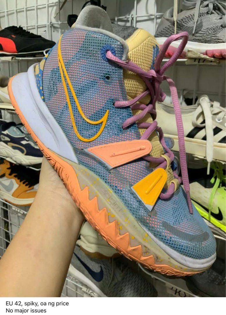 Nike Kyrie 7 Preheat Expressions (Category: Sneakers) located in Caloocan City. Submitted by Twinsters_2nd (Listing ID 1468434637, Image 1). Description: - Model: Nike Kyrie 7 Preheat Expressions - Size: EU 42 - Colorway: Multi-color with pastel blue, yellow, and pink accents - Features: Signature lace closure, forefoot lockdown bands, and textured rubber outsole for court grip - Condition: Solid shape overall with minor signs of wear on the sole
